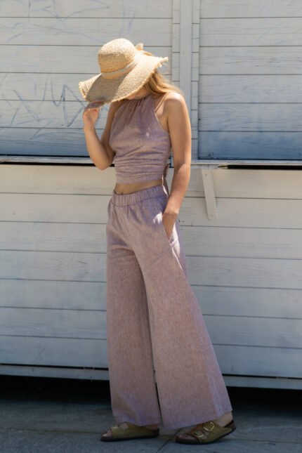 Beige wide-leg summer trousers made of a cotton and linen blend.