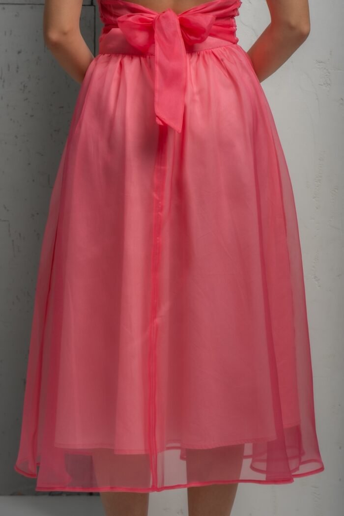 The blonde girl wears a pink BARBARA silk organdy skirt.