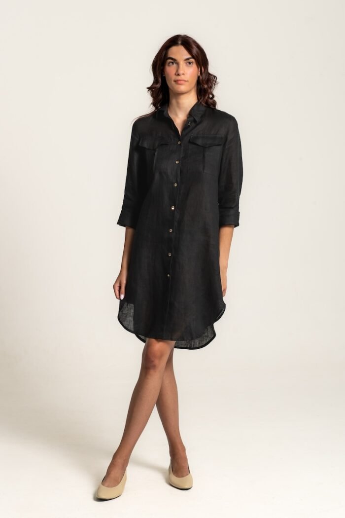 The girl wears a black linen shirt-dress.