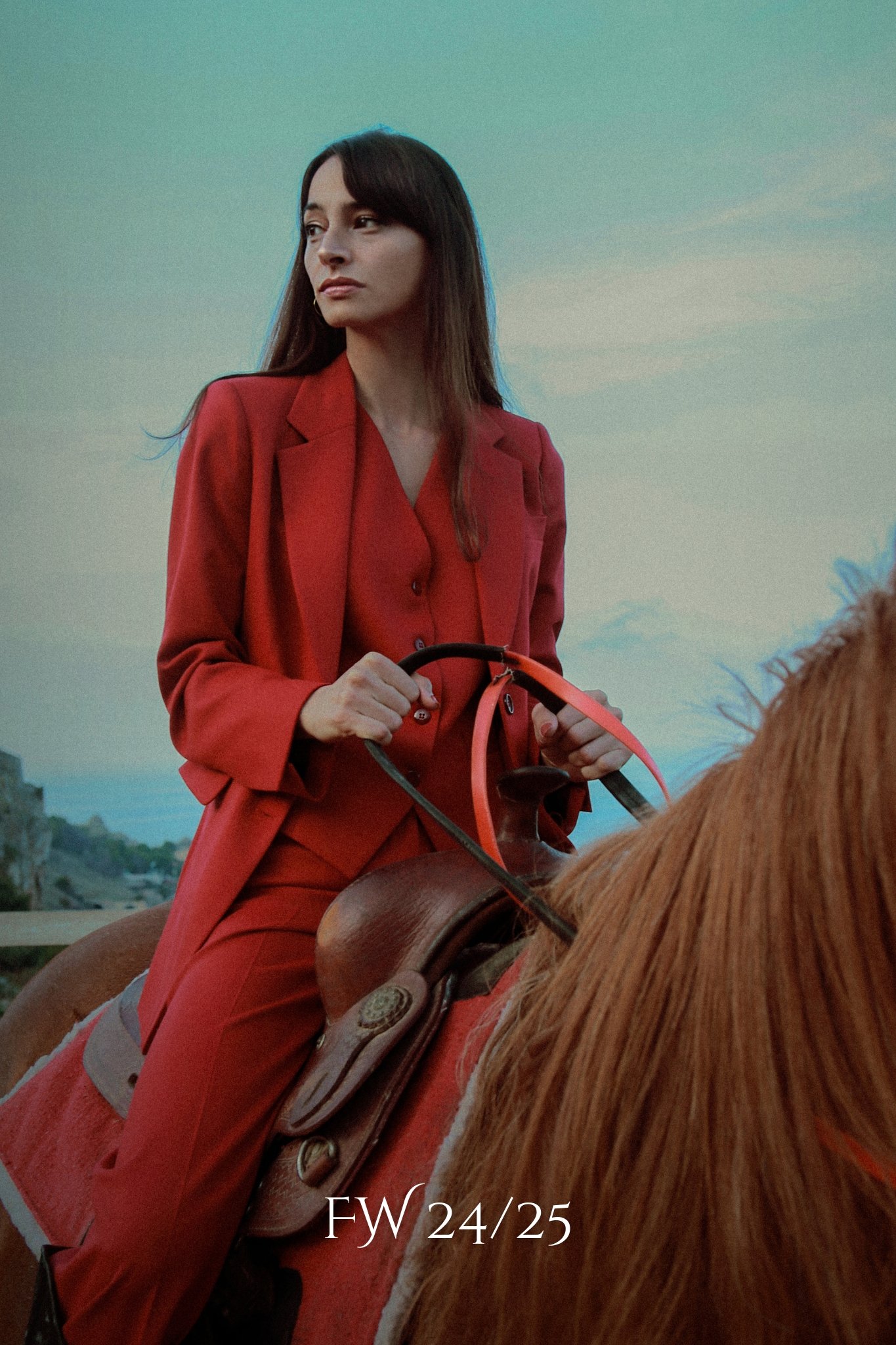 Woman in red set riding a horse