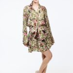 AMELIE dress in green with print, photographed from the front.