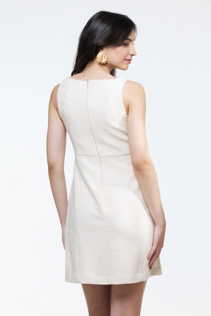 Short IVY dress made of ecru cotton bouclé, photographed from the front.