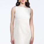 Short IVY dress made of ecru cotton bouclé, photographed from the front.