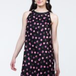 Short black PAVLA dress featuring pink dots, photographed from the front.