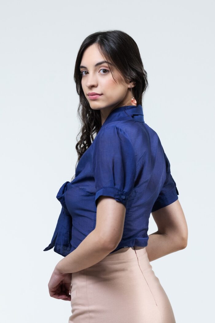 TARA blouse in blue, photographed from the side.