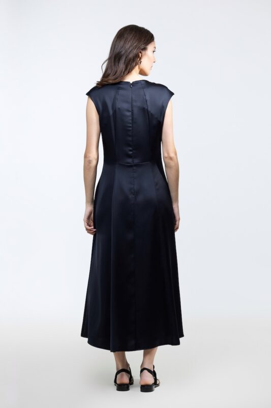 VITA dress in black satin, photographed from the front.
