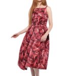 The girl is wearing a red patterned midi dress.